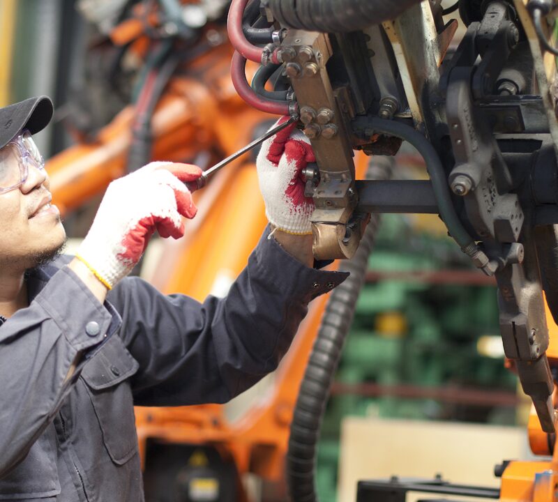 Worker fixing an engine