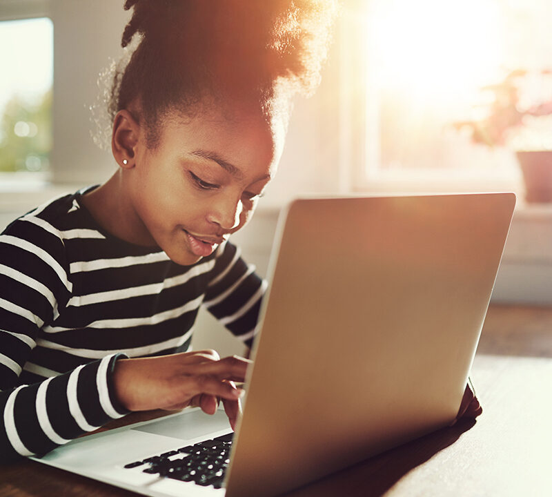 Photo of a student working on a laptop computer