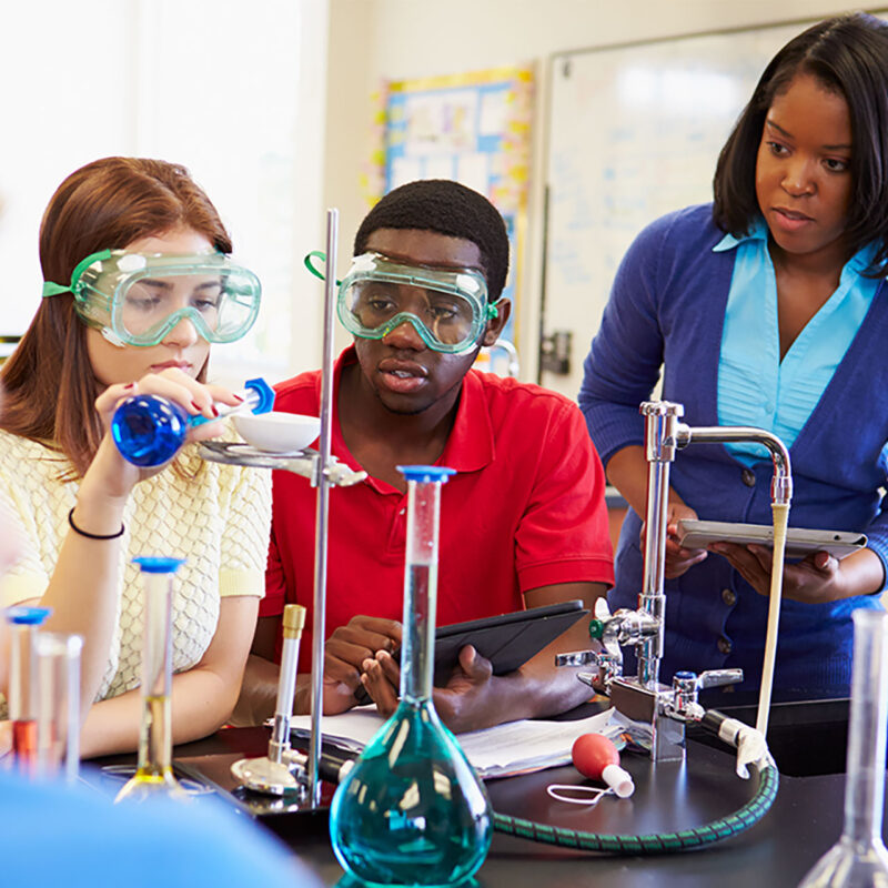 Students in a chemistry lab conducting an experiment.